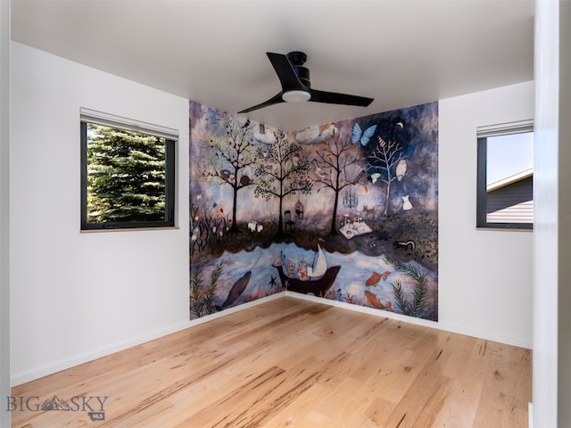 1206 N Cedarview Dr, Bozeman, MT 59715 - empty room featuring wood finished floors and a ceiling fan