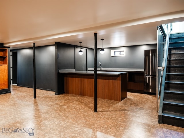 1206 N Cedarview Dr, Bozeman, MT 59715 - kitchen with freestanding refrigerator, light floors, and decorative light fixtures