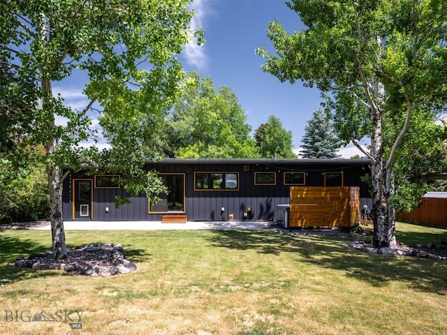 1206 N Cedarview Dr, Bozeman, MT 59715 - mid-century inspired home with board and batten siding and a front yard