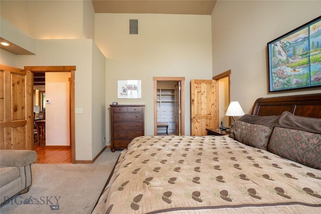 709 Limestone Rd, Bozeman, MT 59715 - carpeted bedroom featuring a high ceiling, a closet, and a walk in closet
