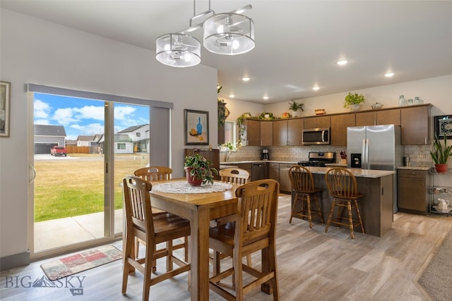 1308 Scooter Ln, Belgrade, MT 59714 - dining room featuring light wood-style flooring and recessed lighting