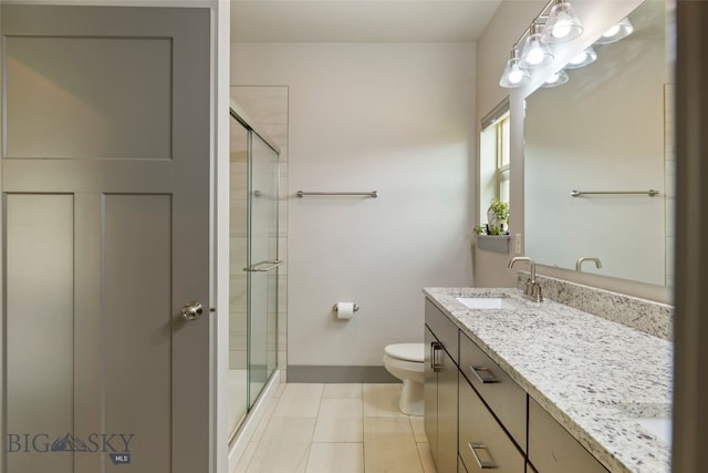 1308 Scooter Ln, Belgrade, MT 59714 - full bath featuring double vanity, a shower stall, and tile patterned flooring