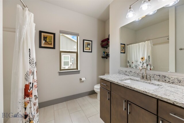 1308 Scooter Ln, Belgrade, MT 59714 - bathroom with vanity, tile patterned floors, and curtained shower