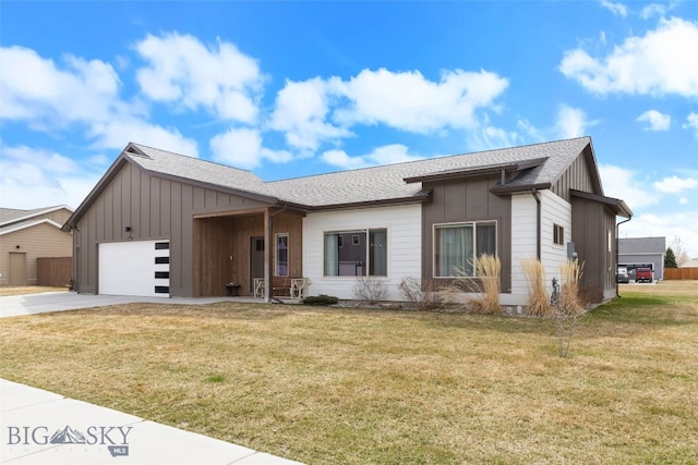 1308 Scooter Ln, Belgrade, MT 59714 - view of front of property with board and batten siding, an attached garage, concrete driveway, and a front yard