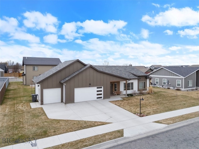 1308 Scooter Ln, Belgrade, MT 59714 - view of front of property with board and batten siding, a garage, driveway, and roof with shingles