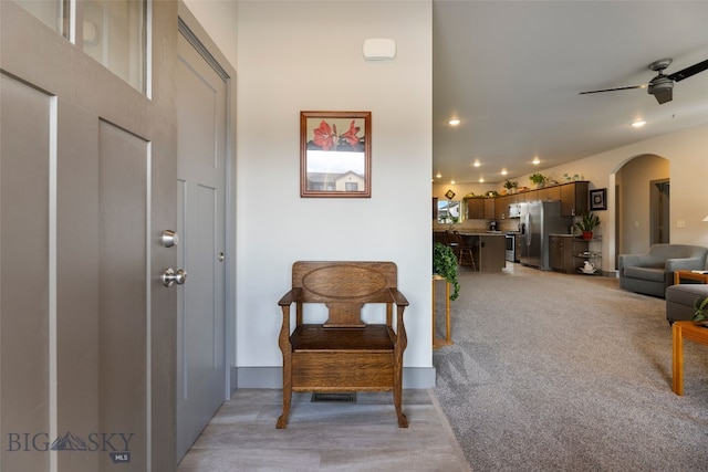 1308 Scooter Ln, Belgrade, MT 59714 - foyer entrance featuring arched walkways, recessed lighting, a ceiling fan, and light wood finished floors