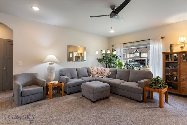 1308 Scooter Ln, Belgrade, MT 59714 - carpeted living area with a ceiling fan and arched walkways