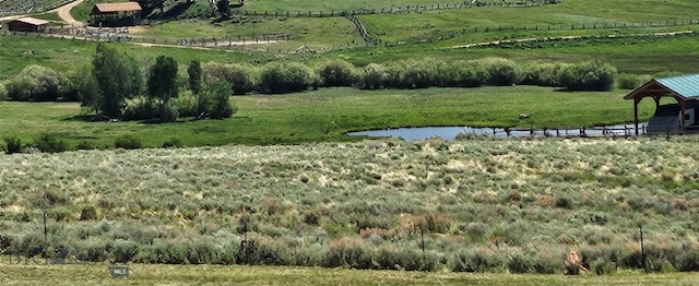 950 White Creek Ln, Polaris, MT 59746 - view of green lawn featuring a view of rural / pastoral area and a water view