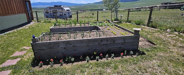 950 White Creek Ln, Polaris, MT 59746 - view of yard featuring a garden, a mountain view, and a rural view