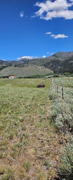950 White Creek Ln, Polaris, MT 59746 - view of mountain backdrop with rural landscape