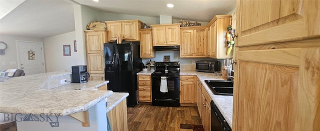 950 White Creek Ln, Polaris, MT 59746 - kitchen with black appliances, vaulted ceiling, under cabinet range hood, light countertops, and light brown cabinets