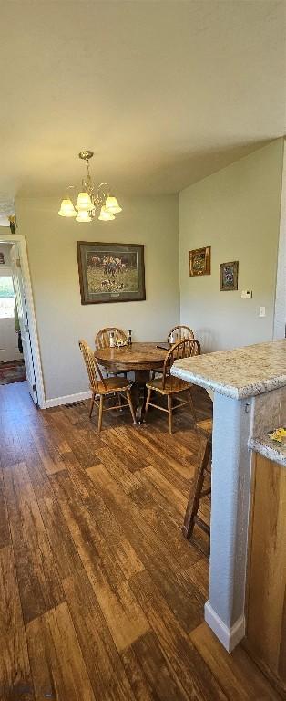 950 White Creek Ln, Polaris, MT 59746 - dining area featuring dark wood finished floors and a chandelier