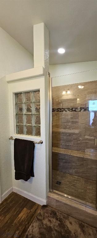 950 White Creek Ln, Polaris, MT 59746 - full bathroom featuring a stall shower and wood finished floors