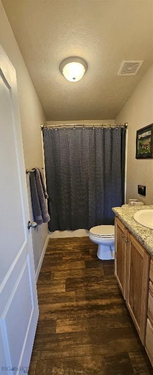950 White Creek Ln, Polaris, MT 59746 - full bathroom featuring vanity, wood finished floors, and a shower with shower curtain