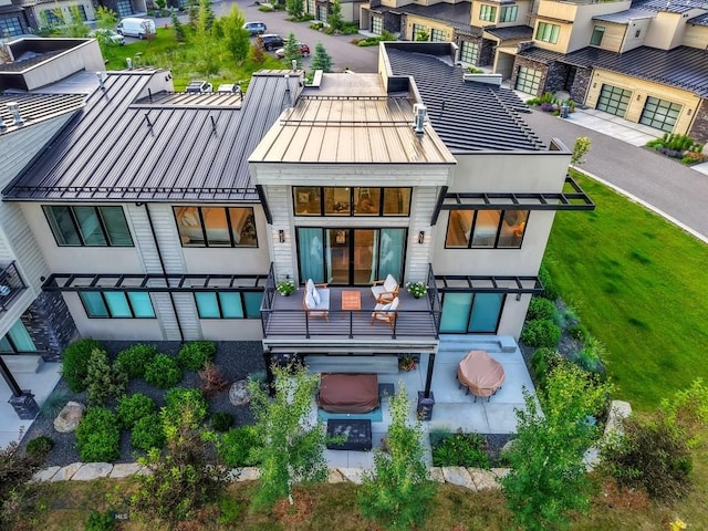 20 Caymus Ln Unit D, Bozeman, MT 59718 - back of house with a standing seam roof, a metal roof, a residential view, and stucco siding