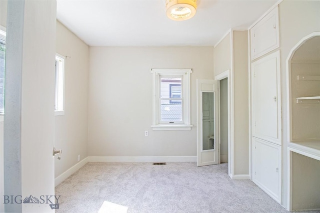 1823 Lafayette, Butte, MT 59701 - unfurnished bedroom with multiple windows and carpet