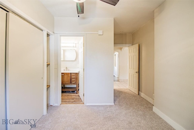 1823 Lafayette, Butte, MT 59701 - unfurnished bedroom featuring light carpet, ensuite bath, and a ceiling fan