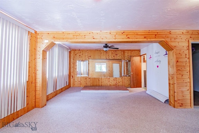 1823 Lafayette, Butte, MT 59701 - empty room featuring carpet flooring, wood walls, and ceiling fan