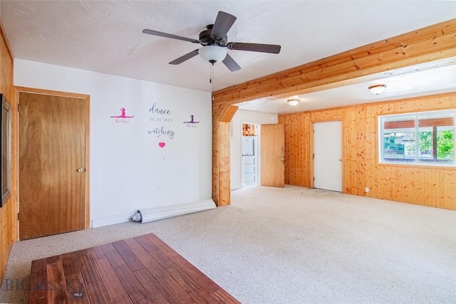 1823 Lafayette, Butte, MT 59701 - unfurnished room with carpet floors, wooden walls, and ceiling fan