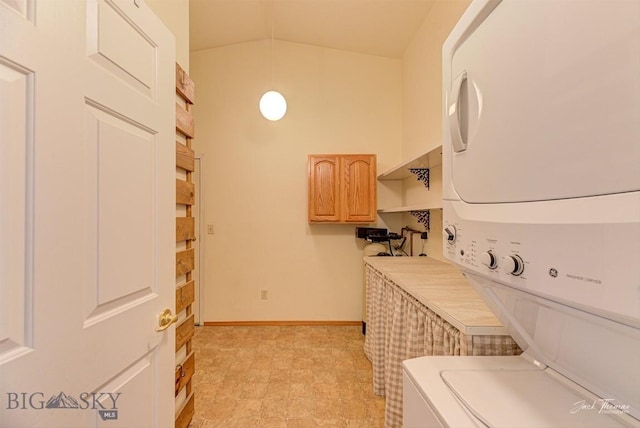 513 Burnham Pl, Helena, MT 59601 - laundry room with estacked washer and dryer and baseboards