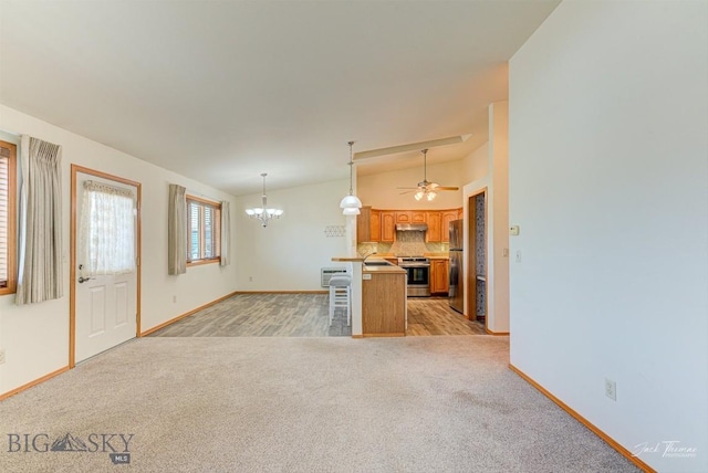 513 Burnham Pl, Helena, MT 59601 - unfurnished living room with light carpet, a chandelier, ceiling fan, and vaulted ceiling