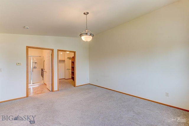 513 Burnham Pl, Helena, MT 59601 - unfurnished room featuring light colored carpet, vaulted ceiling, and a smoke detector