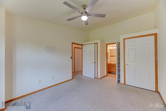 513 Burnham Pl, Helena, MT 59601 - unfurnished bedroom featuring light colored carpet, ensuite bathroom, and ceiling fan