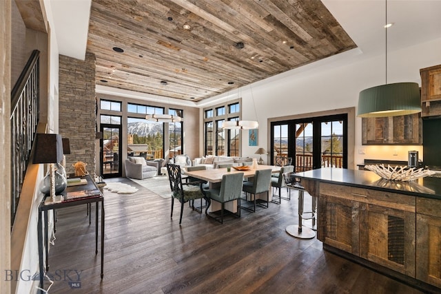 77 Tanager Frk Unit 29, Big Sky, MT 59716 - dining space featuring wood ceiling, french doors, dark wood-style floors, plenty of natural light, and a high ceiling