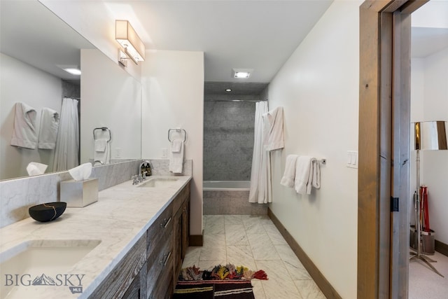 77 Tanager Frk Unit 29, Big Sky, MT 59716 - bathroom featuring marble look tile flooring, double vanity, and tiled shower / bath combo