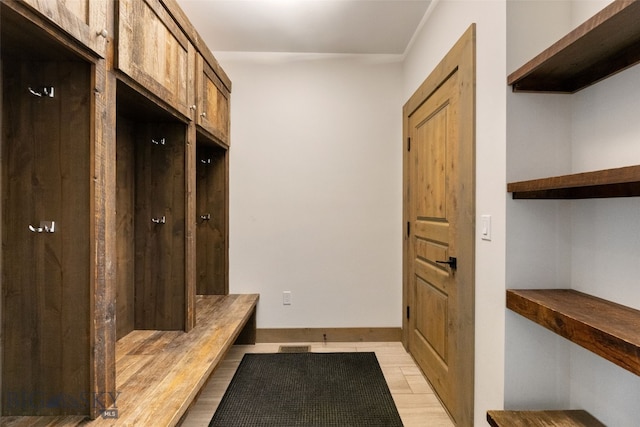 77 Tanager Frk Unit 29, Big Sky, MT 59716 - mudroom with light wood finished floors and baseboards