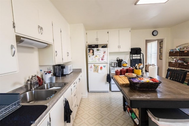721 W Park Ave, Anaconda, MT 59711 - kitchen with white appliances, light flooring, and white cabinets