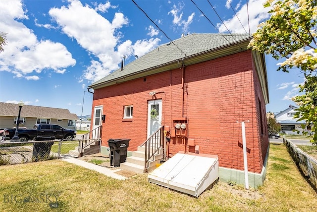 721 W Park Ave, Anaconda, MT 59711 - back of house featuring entry steps and brick siding
