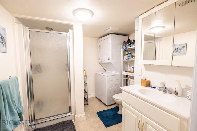 721 W Park Ave, Anaconda, MT 59711 - full bath featuring estacked washer and dryer, a stall shower, vanity, and tile patterned flooring