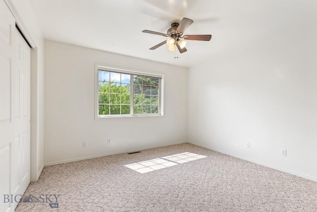 605 Prairie Ave, Bozeman, MT 59718 - unfurnished bedroom with light colored carpet, a closet, and a ceiling fan