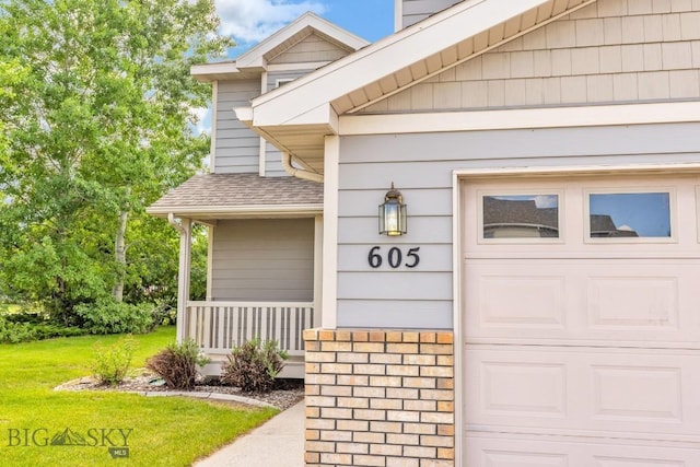 605 Prairie Ave, Bozeman, MT 59718 - entrance to property with a yard, a garage, and a shingled roof