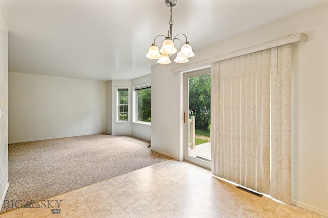 605 Prairie Ave, Bozeman, MT 59718 - empty room with a chandelier and carpet floors