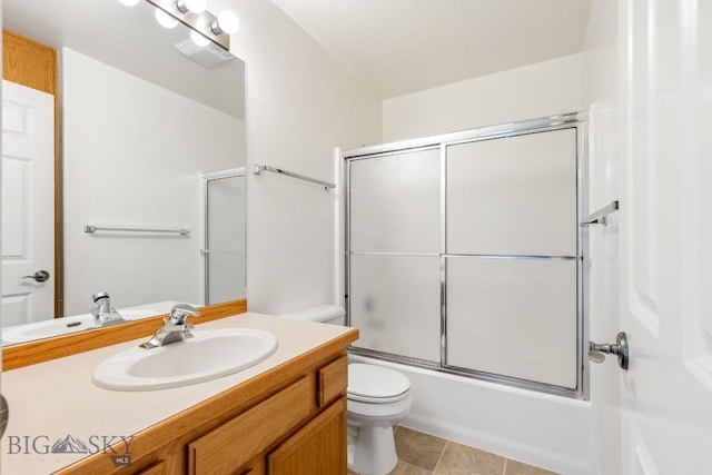 605 Prairie Ave, Bozeman, MT 59718 - bathroom with vanity, bath / shower combo with glass door, and tile patterned floors