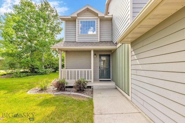 605 Prairie Ave, Bozeman, MT 59718 - entrance to property with covered porch, a yard, and roof with shingles