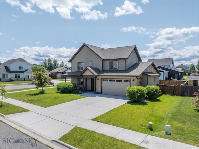 56 Koch Peak Ct, Bozeman, MT 59718 - view of front of home with concrete driveway, an attached garage, a residential view, and roof with shingles