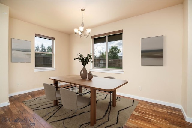56 Koch Peak Ct, Bozeman, MT 59718 - dining area with a chandelier and wood finished floors