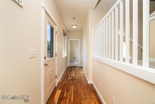 56 Koch Peak Ct, Bozeman, MT 59718 - corridor with dark wood-type flooring and baseboards