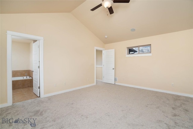56 Koch Peak Ct, Bozeman, MT 59718 - unfurnished bedroom with carpet floors, lofted ceiling, connected bathroom, and a ceiling fan