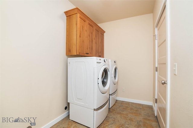 56 Koch Peak Ct, Bozeman, MT 59718 - laundry area featuring washing machine and dryer, cabinet space, and light stone finish flooring