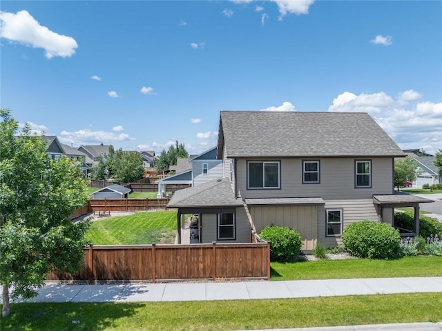 56 Koch Peak Ct, Bozeman, MT 59718 - back of house featuring roof with shingles and a residential view