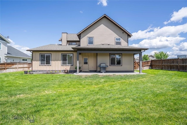 56 Koch Peak Ct, Bozeman, MT 59718 - rear view of house with a patio, a fenced backyard, board and batten siding, and a shingled roof