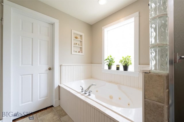 911 N Aster, Bozeman, MT 59718 - bathroom featuring a whirlpool tub, wainscoting, and tile patterned floors