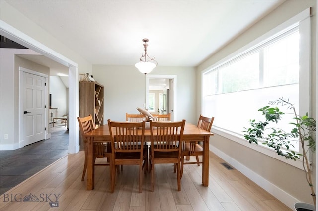 911 N Aster, Bozeman, MT 59718 - dining space featuring light wood-style flooring and baseboards