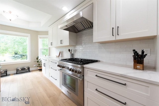 911 N Aster, Bozeman, MT 59718 - kitchen with stainless steel range, exhaust hood, a raised ceiling, white cabinets, and light stone counters