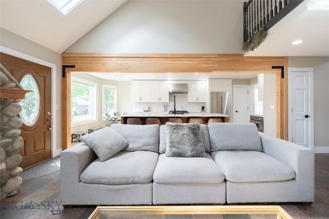 911 N Aster, Bozeman, MT 59718 - living room with high vaulted ceiling, a skylight, and recessed lighting