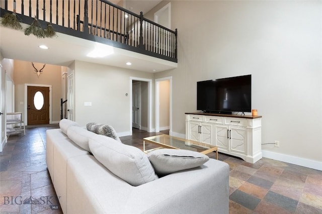 911 N Aster, Bozeman, MT 59718 - living area with stone tile floors, a high ceiling, and recessed lighting